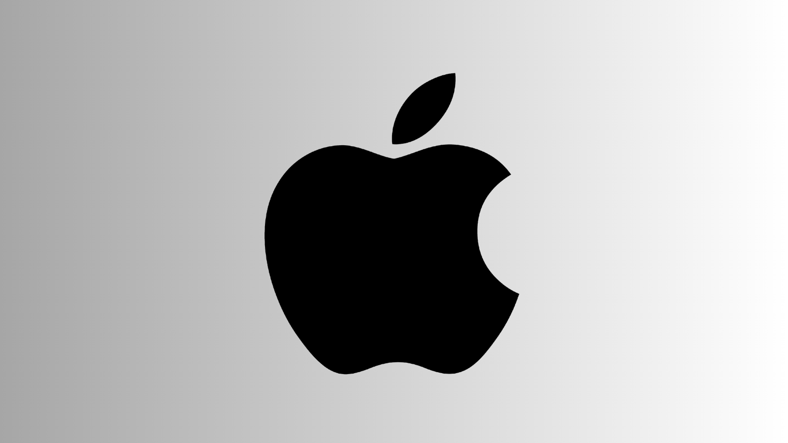 Gri degrade zemin üzerinde büyük siyah Apple logosu.